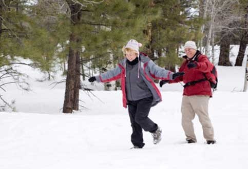 old couple in the snow, aging , healthy retirement, happy